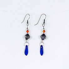 Elegant earrings with antique silver, blue, and orange beads