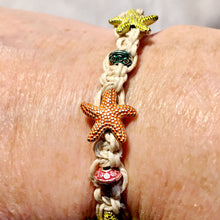 Beachy macrame bracelet with orange and yellow starfish beads