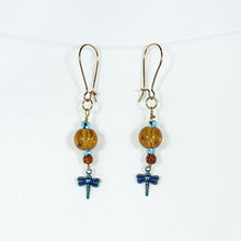 Earrings with amber crackle-glass bead and blue dragonfly dangle charm