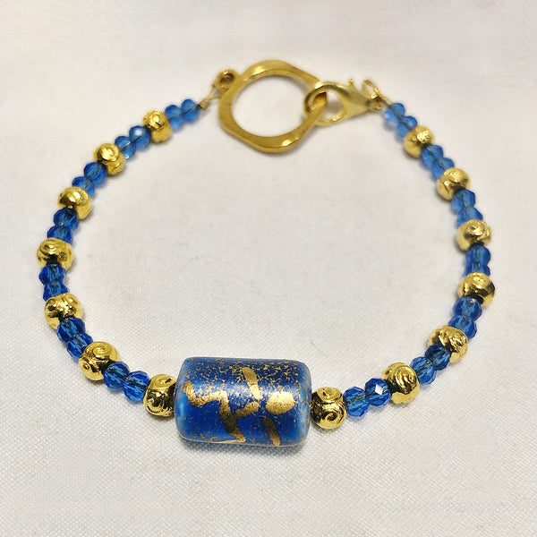 Blue and gold bracelet with stick figure man bead