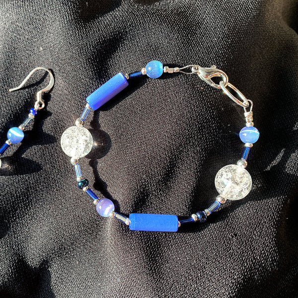 Bracelet featuring blue crackle-glass beads and silver trim