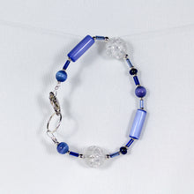 Bracelet featuring blue crackle-glass beads and silver trim