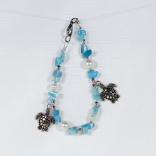 Bracelet set featuring sea turtles, faux pearls, turquoise-coloured chip beads, and silver trim