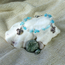 Bracelet set featuring sea turtles, faux pearls, turquoise-coloured chip beads, and silver trim