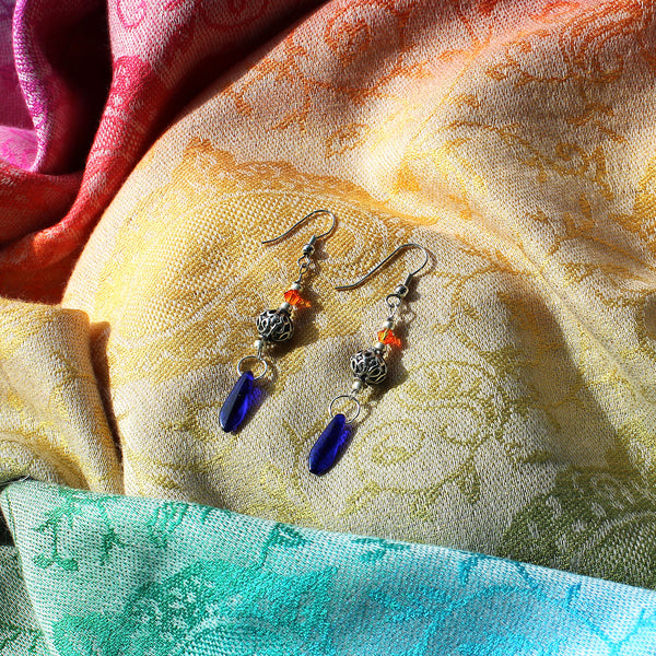 Elegant earrings with antique silver, blue, and orange beads