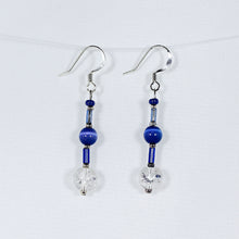 Earrings featuring blue crackle-glass beads and silver trim