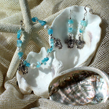 Earrings and bracelet set featuring sea turtles, faux pearls, turquoise-coloured chip beads, and silver trim