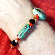 Bracelet with green and orange ceramic beads