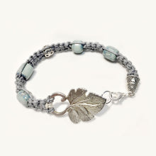 Grey macrame bracelet with ceramic beads and leaf clasp