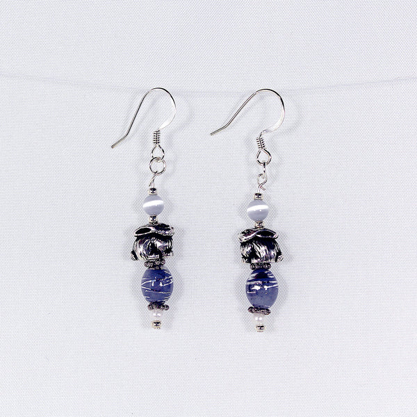 Earrings with silver bunny charms and lavender-colored swirl beads