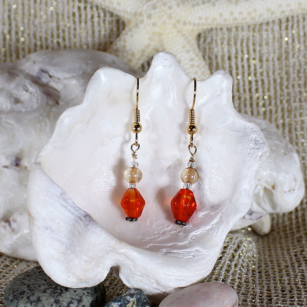 Orange glass swirl earrings with 14k gold trim