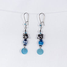 Earrings with silver bunny charms and turquoise-colored swirl beads and turquoise dangle shell chip bead