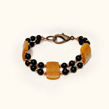 Two-Strand Bracelet with Polished Peach Agate, Copper, and Black Stone Beads