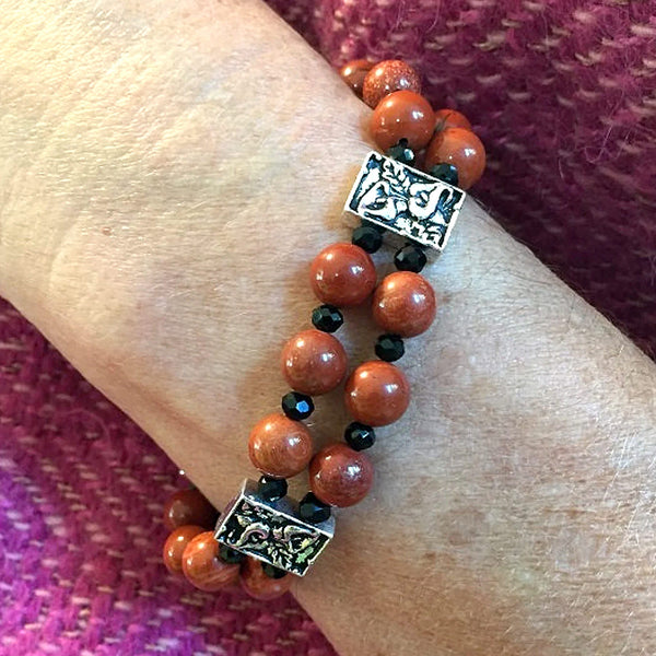 Two-strand red jasper bracelet with calla lily metal beads