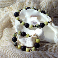 Bracelet featuring yellow kiwi jade and black lava beads - adult and youth size