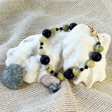 Bracelet featuring yellow kiwi jade and black lava beads