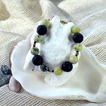 Bracelet featuring yellow kiwi jade and black lava beads - youth size